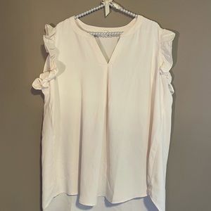 Ruffled sleeveless dress top.